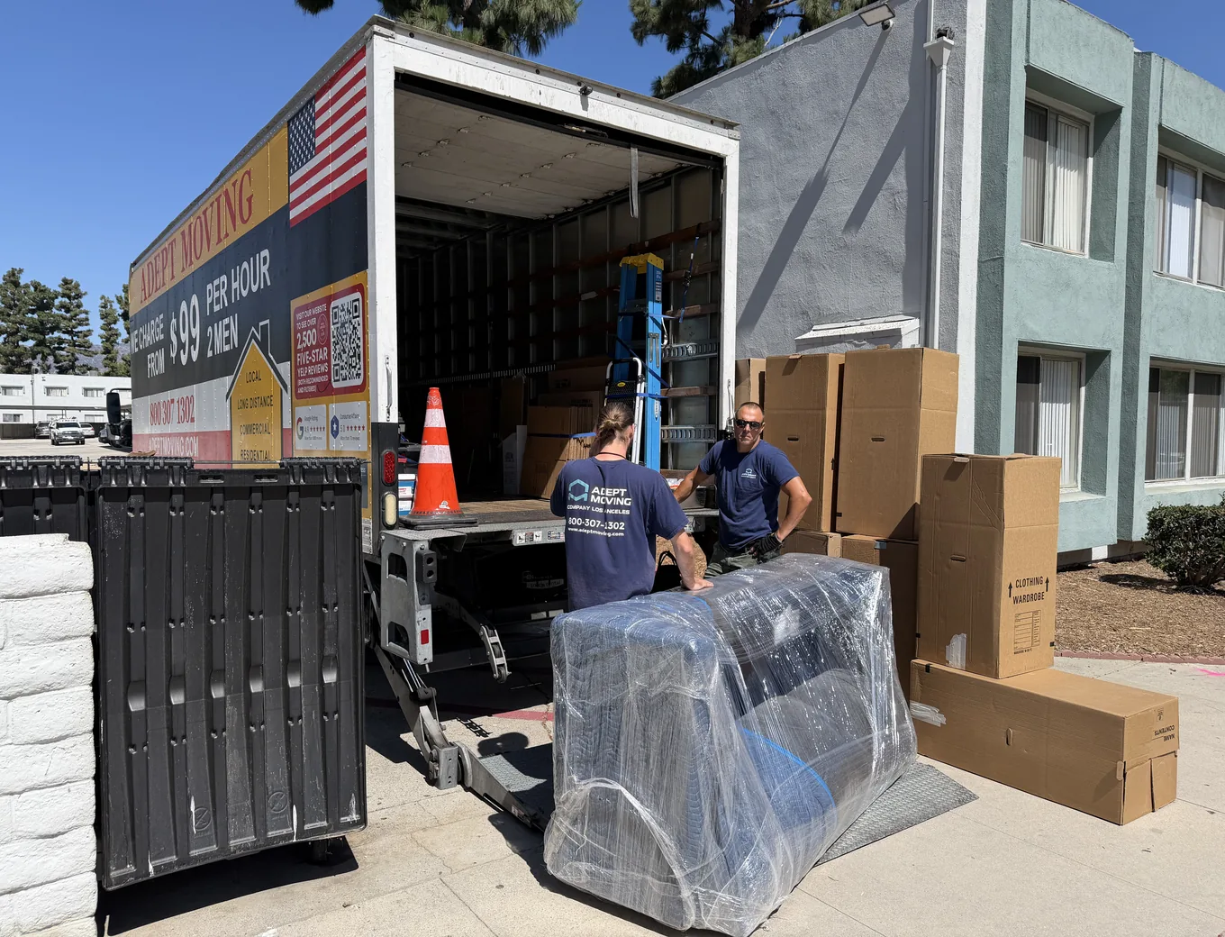 Adept Moving movers loading wrapped furniture at an apartment complex on Vintage Street in Chatsworth, 91311
