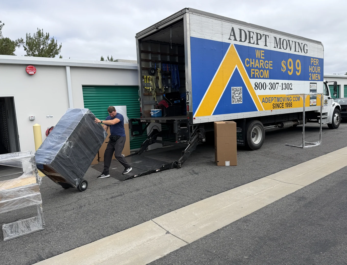 Adept movers loading wrapped furniture into the truck in Irvine, 92618