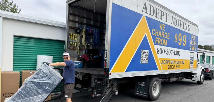 Adept movers loading wrapped furniture into the truck in Irvine, 92618