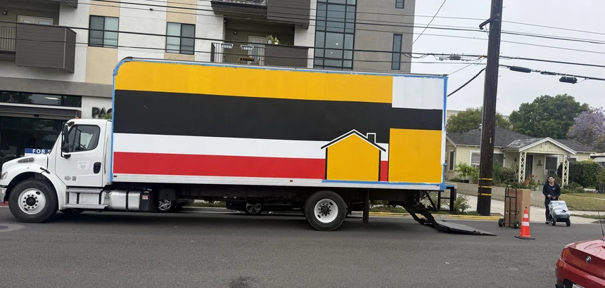 Adept Moving branded box truck, side view, on North Chandler Avenue in Monterey Park, 91755