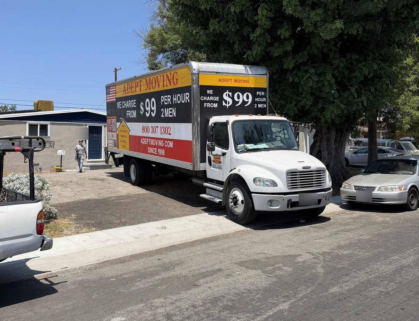 Adept Moving truck parked by a single-story house on Mammoth Avenue in Panorama City, 91402