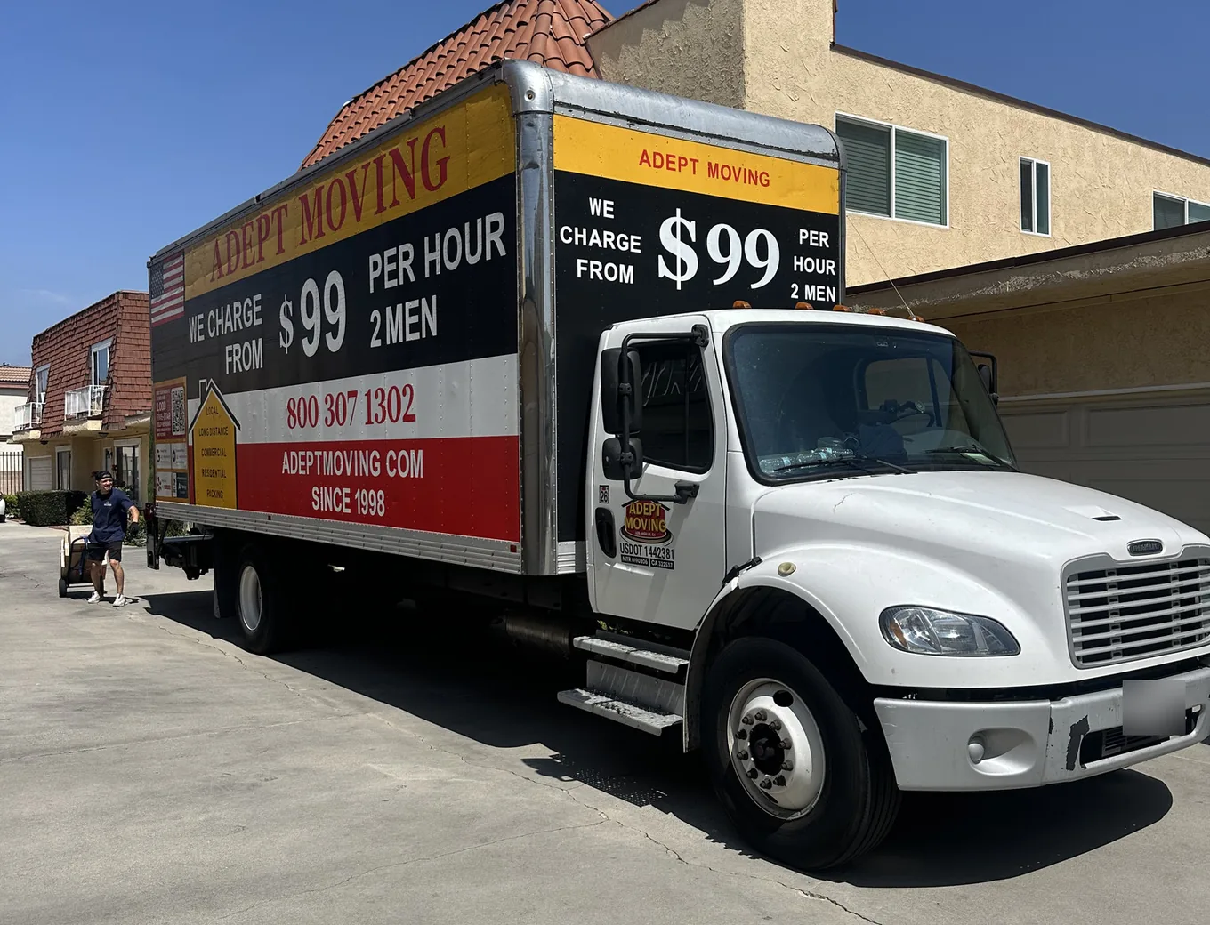 Adept Moving truck in the garage lane of a townhome complex off Cedros Avenue in Panorama City