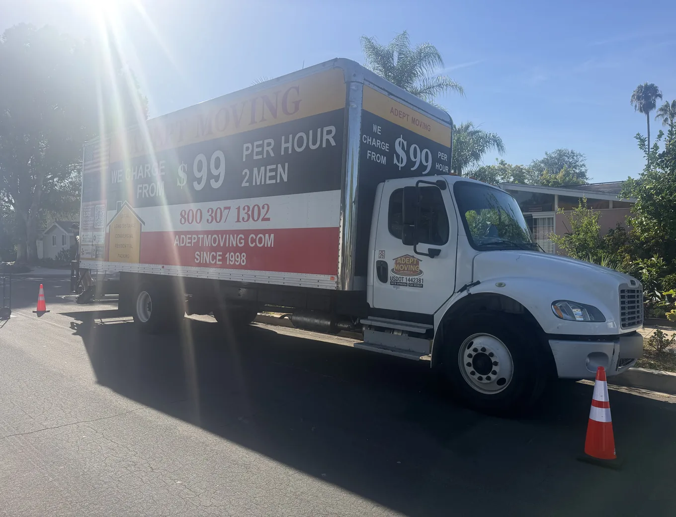 Adept Moving truck with cones by 1950s ranch homes at the corner of Geyser Avenue in Reseda
