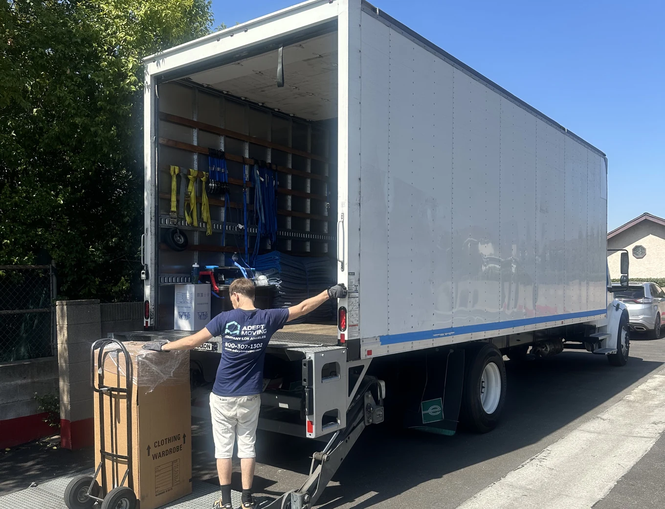 Adept mover loading a wrapped item onto the truck liftgate in San Dimas, 91773