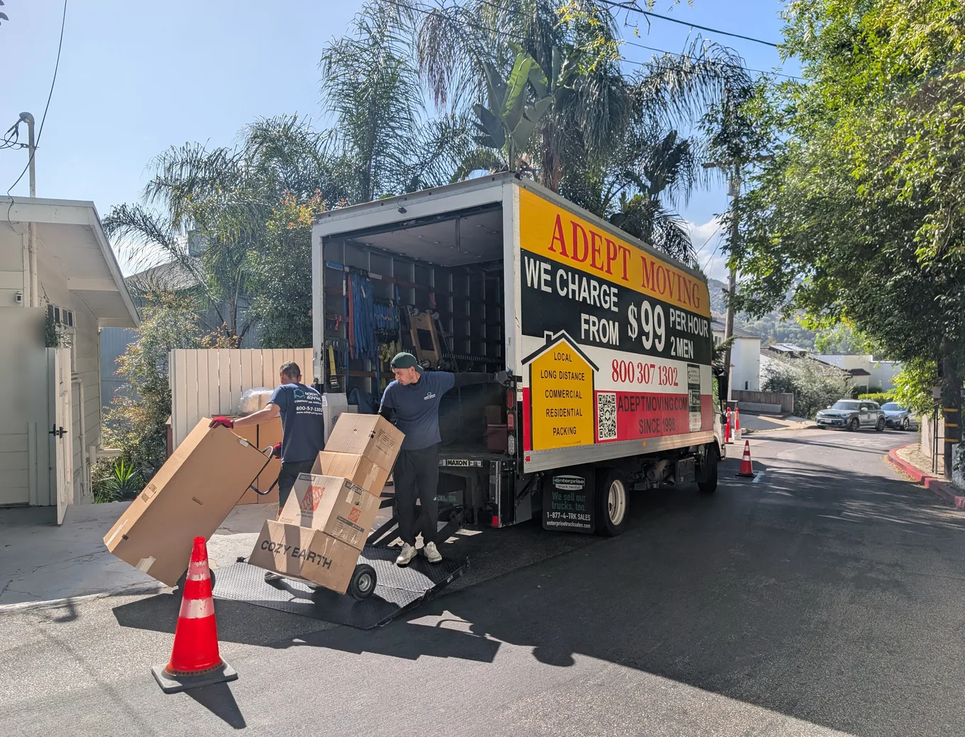 Adept Moving movers wheeling boxes to the truck on Rayneta Drive in Sherman Oaks, 91403