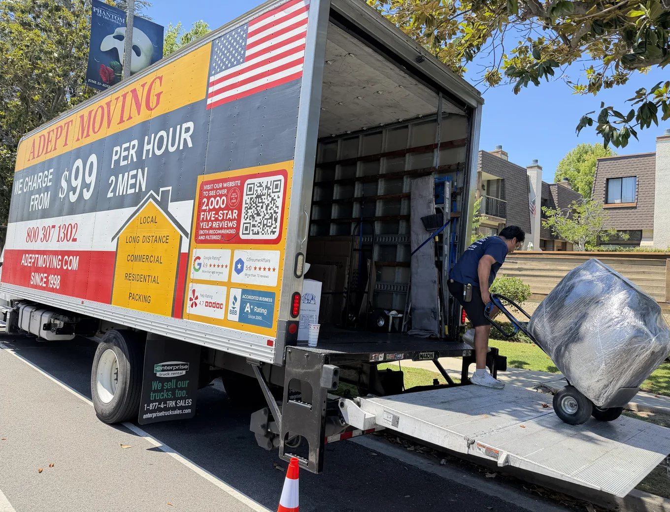 Adept Moving mover loading wrapped furniture onto the truck liftgate in Sherman Oaks, 91423