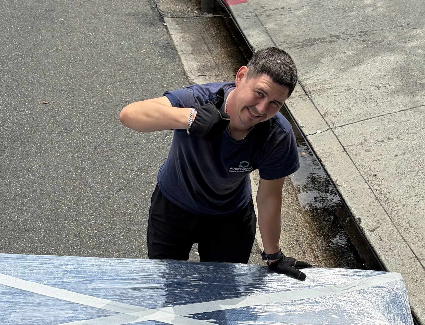 Adept Moving mover thumbs up wrapped furniture in Woodland Hills