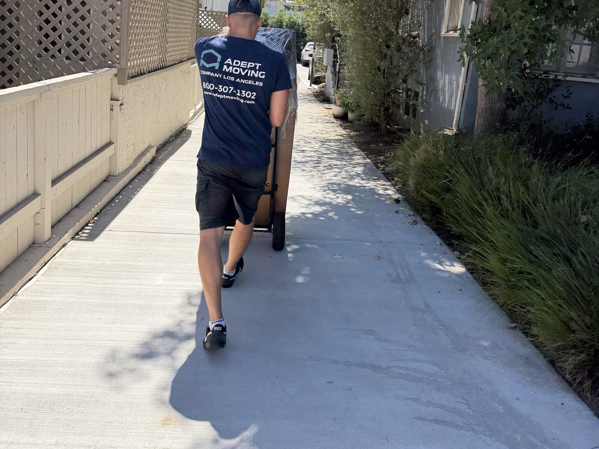 Adept Moving mover on the long walkway between the townhouses