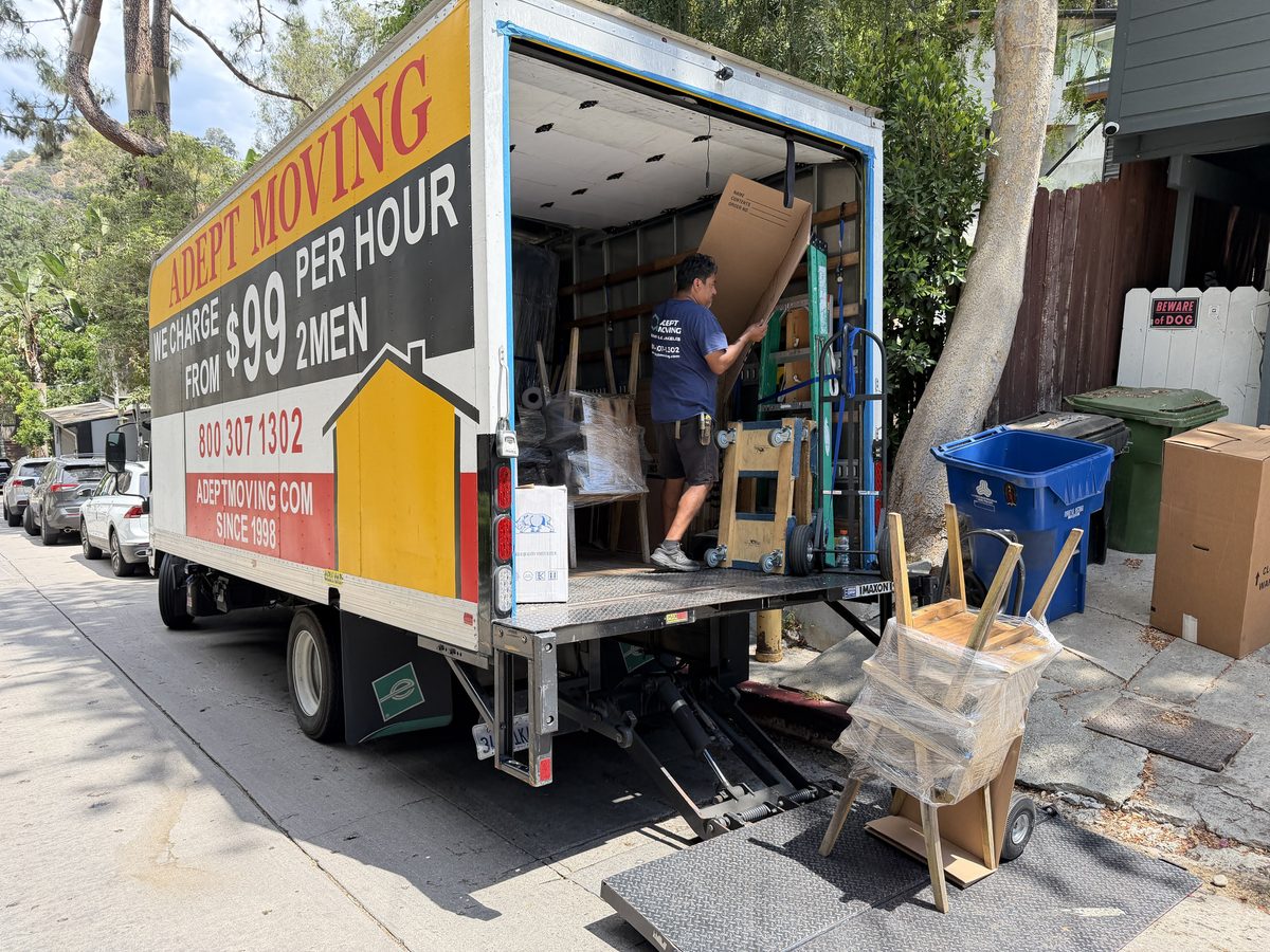 Adept Moving truck with the ramp down at the curb on Stanley Hills Drive in Laurel Canyon