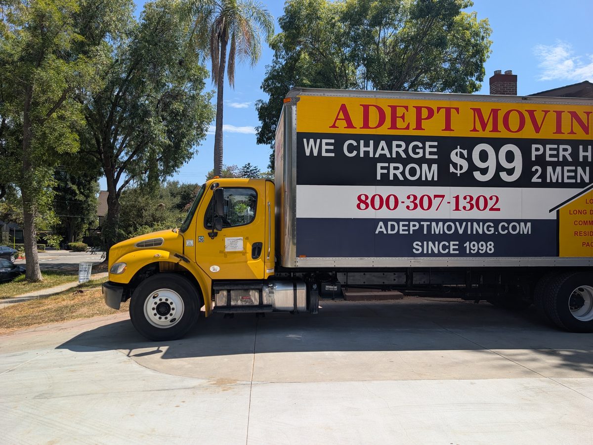 Adept Moving box truck parked under palm and shade trees in South Pasadena